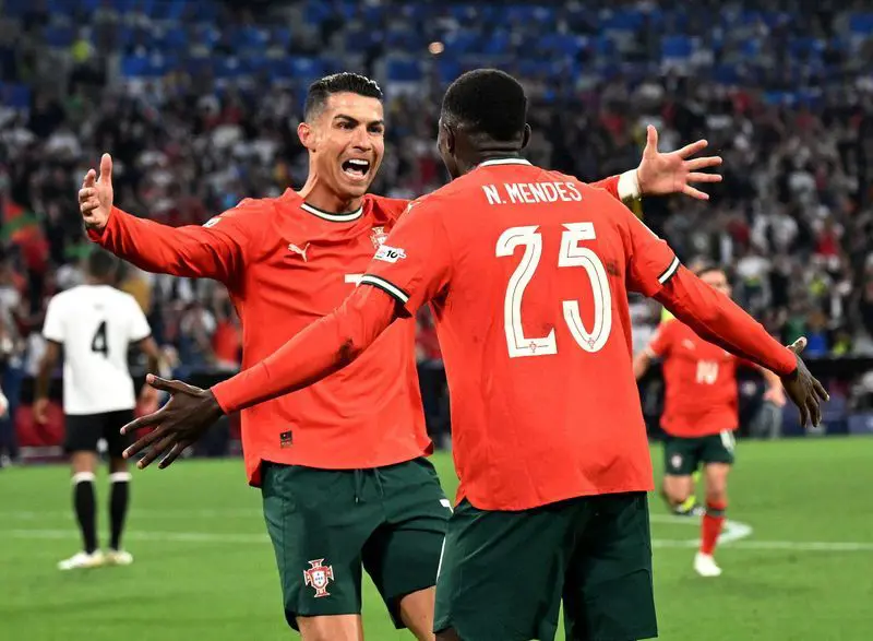 Nuno Mendes and Cristiano Ronaldo celebrate Portugal’s victory in Nations League match with passionate on-field moment